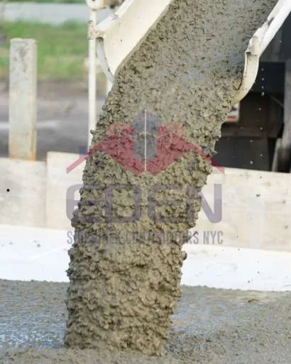 Concrete being poured from a mixer chute