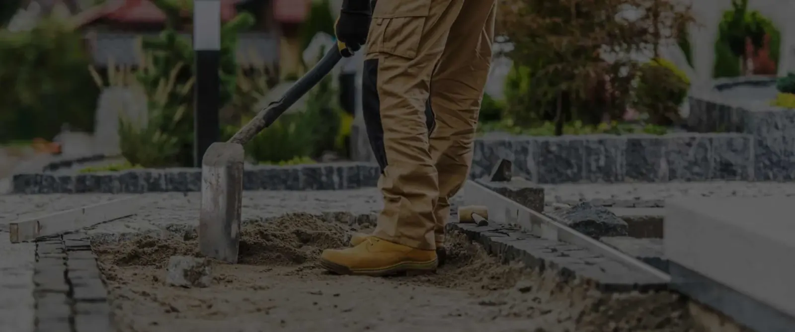 Sidewalk contractors at work on a concrete sidewalk in Queens, New York