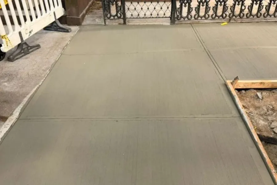 Restored Brooklyn sidewalk concrete after the violation repair was completed
