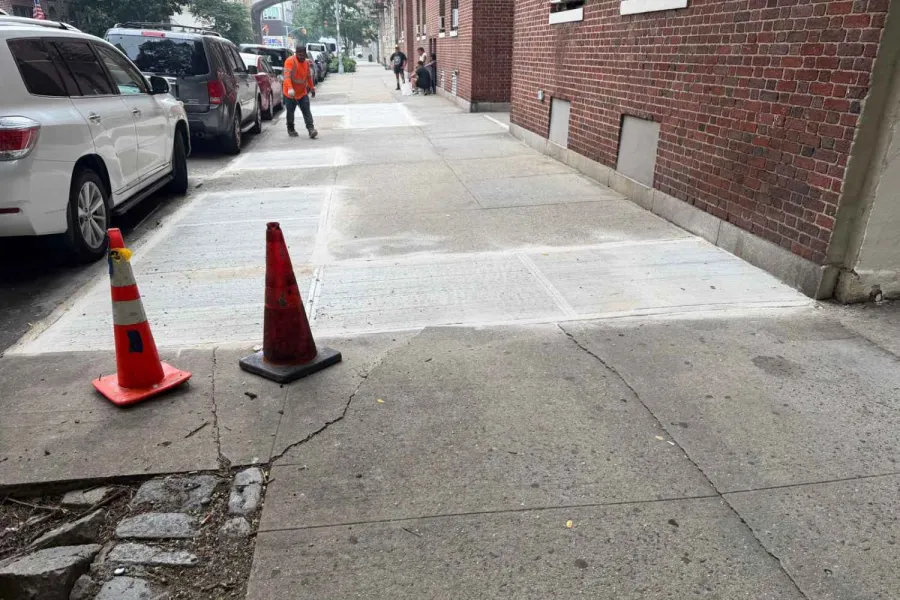 Completed sidewalk replacement outside the Sunnyside rental building