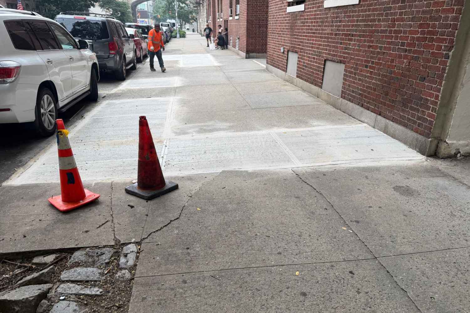 newly replaced concrete sidewalk slabs after repair work in sunnyside queens