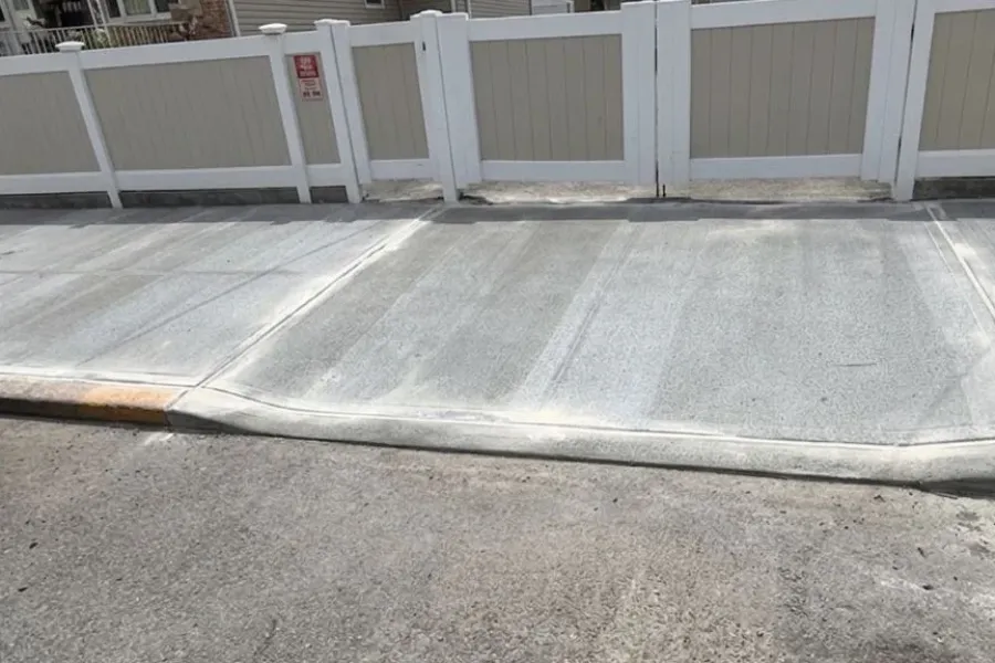 Completed sidewalk and curb cut repair in Queens, New York