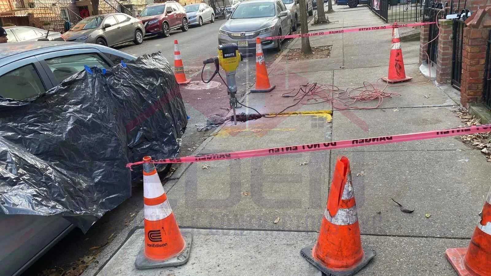Uneven concrete sidewalk showing a common cause of NYC DOT sidewalk violations